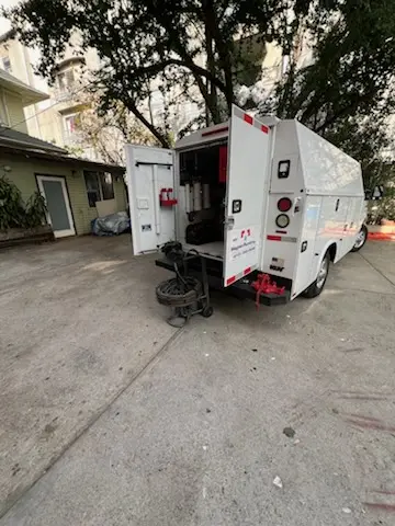 Magnet Plumbing service vehicle on-site for Grease Trap Cleaning in Battery Marina Village